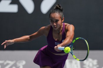 Leylah Fernandez of Canada plays a forehand return to Janice Tjen of Indonesia during their first round match at the Australian Open tennis championship in Melbourne, Australia, Tuesday, Jan. 20, 2026. (AP Photo/Dar Yasin)