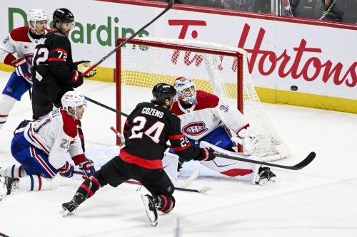 Montreal Canadiens goaltender Jacob Fowler (32) tracks the puck as Ottawa Senators' Dylan Cozens (24) falls to the ice during third period NHL hockey action in Ottawa, on Wednesday, March 11, 2026. THE CANADIAN PRESS/Spencer Colby