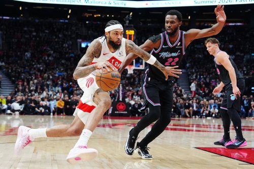 Toronto Raptors' Brandon Ingram (3) drives past Miami Heat's Andrew Wiggins (22) during first half NBA basketball action in Toronto on Tuesday, April 7, 2026. THE CANADIAN PRESS/Frank Gunn