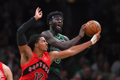 Toronto Raptors forward Collin Murray-Boyles, left, and Boston Celtics center Neemias Queta vie for control of the ball in the first half of an NBA basketball game, Sunday, April 5, 2026, in Boston. (AP Photo/Steven Senne)