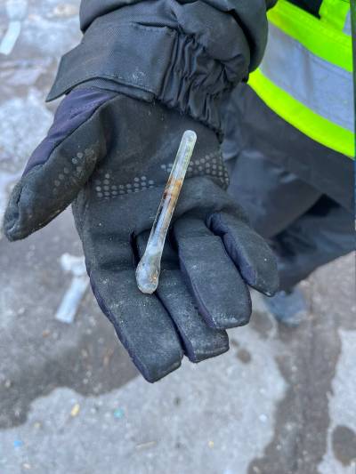 Bear Clan members gather needles and drug paraphernalia during a patrol of Winnipeg&rsquo;s North End in March 2023. (File)