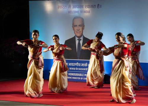 Dancers perform as Canadian Prime Minister Mark Carney arrives in New Delhi, India on Sunday, a visit that marks a significant step in the reltionship between the two countries. (The Canadian Press)