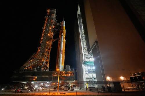 NASA's Artemis II SLS (Space Launch System) moon rocket with the Orion spacecraft ends a 10-hour journey from the launch pad as it enters the Vehicle Assembly Building at the Kennedy Space Center in Cape Canaveral, Fla., on Wednesday. The earliest launch date for the Artemis II mission is now April 1. (The Associated Press)