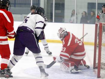 Massey forward Joe Balabanski, who scored the game winning goal in the opening period, searches for a rebound in front of the Huskies net as netminder Nicolas McDuff makes a save during Game 1 of the Westman High School Hockey League playoff quarterfinals at the Sportsplex on Sunday night. (Massimo De Luca-Taronno/The Brandon Sun)