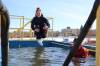 LEFT and RIGHT: Brooke Huculak of the Brandon Police Service plunges into the water last year during the Polar Plunge. (Abiola Odutola/The Brandon Sun files)