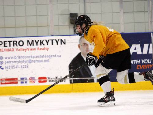 Victoria Mann of the Assiniboine College Cougars rushes toward a puck during 3 on 3 practice at the Sportsplex on Monday night. Her team will head to Maryland Heights, St. Louis, on Friday for the American Collegiate Hockey Association women&rsquo;s Division 2 national tournament, which goes from Sunday to Thursday. (Massimo De Luca-Taronno/The Brandon Sun)