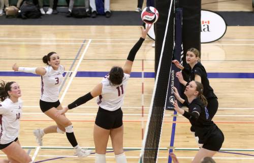 Tyra Lasuik saves a tight pass as the Assiniboine College Cougars take on the VIU Mariners during their CCAA women&rsquo;s volleyball national quarterfinal in Niverville on Wednesday. (Thomas Friesen/The Brandon Sun)
