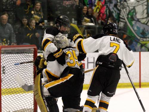 Aurick Veldhuisen (35), Jace Woloski (17) hug it out as Jordan Lang (7) comes to celebrate after the Brandon Wheat Kings defeated the Winnipeg Bruins Gold to advance to the championship against the Eastman Selects. (Massimo De Luca-Taronno/The Brandon Sun)