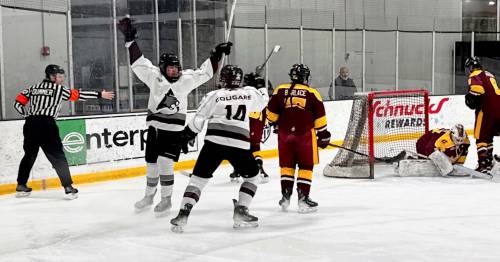 Assiniboine College Cougars forward Brooke Cyr celebrates her game-opening goal with teammate Jenna Walker (14) as Central Michigan University goalie Lainie Fliegel (37), forward Alyssa Borlace (15) and blue-liner Emily Musser (6) look on during a round-robin game in Pool C of the American Collegiate Hockey Association&rsquo;s women&rsquo;s Division 2 national championship on Monday in Maryland Heights, Mo. The Cougars won 10-2. (Courtesy Assiniboine College)
                                March 16, 2026