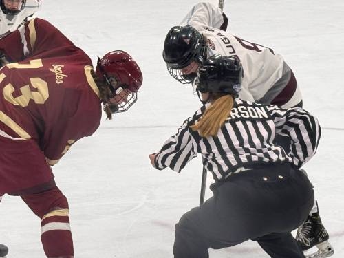 Veronica Asquith takes a face-off during semifinal action against Boston College. (Photo courtesy Assiniboine College)