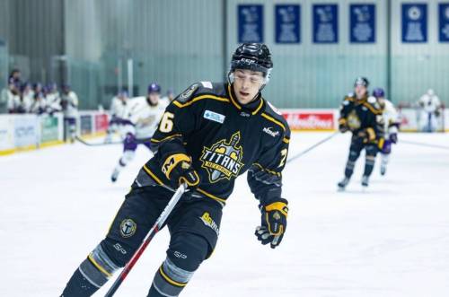 Addison McIntosh of the Neepawa Titans grabs a puck from the corner against the Winnipeg Monarchs during Manitoba Junior Hockey League action at the hockey for all centre in November. (Submitted)