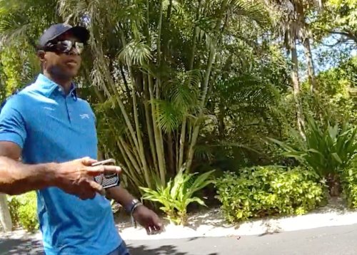 In this image from police body camera video released by the Martin County, Fla., Sheriff's Office, golfer Tiger Woods hangs up his cellphone and tells a sheriff deputy “I was just talking to the president