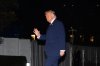 President Donald Trump waves on the South Lawn as he returns to the White House following a trip to Florida, Monday, March 9, 2026, in Washington. (AP Photo/Allison Robbert)