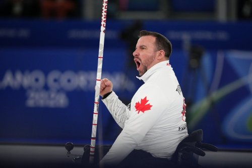 Jon Thurston, of Canada, reacts during the wheelchair curling mixed team gold medal game versus China at the 2026 Winter Paralympics, in Cortina d'Ampezzo, Italy, Saturday, March 14, 2026. (AP Photo/Emilio Morenatti)