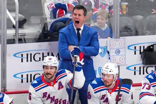New York Rangers head coach Mike Sullivan, centre top, yells instructions during the first period against the Penguins in Pittsburgh on Saturday, Jan. 31, 2026. (AP Photo/Gene J. Puskar)