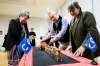 Métis National Council president Victoria Pruden, left, Canadian poet Gregory Scofield, centre, and Audain Indigenous Curatorial scholar-in-residence Sherry Farrell Racette unveil a model Métis Dog Sled following its repatriation from the Vatican collection at the Canadian Museum of History in Gatineau, Que., on Wednesday, Feb. 25, 2026. THE CANADIAN PRESS/Spencer Colby