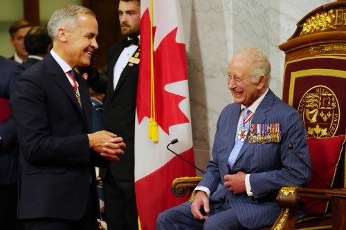 Prime Minister Mark Carney, left, speaks with King Charles ahead of the King delivering the speech from the throne in the Senate in Ottawa on Tuesday, May 27, 2025. THE CANADIAN PRESS/Chris Young