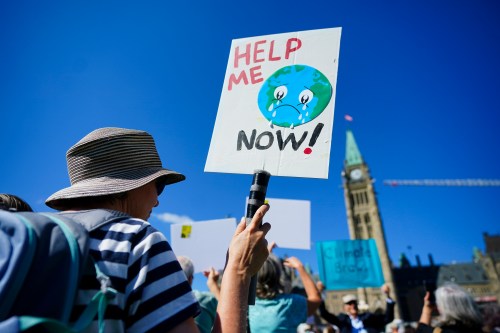People participate in a climate protest on Parliament Hill in Ottawa on Friday, Sept. 15, 2023. THE CANADIAN PRESS/Sean Kilpatrick