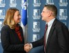 Quebec Conservative Leader Eric Duhaime shakes hand with independent MNA Maïté Blanchette Vézina, left, after she decided to join the Quebec Conservative Party to sit at the legislature in Quebec City on Tuesday, March 24, 2026. THE CANADIAN PRESS/Jacques Boissinot
