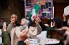 People demonstrate against new alcohol restrictions that limit sales largely to Christian areas in Damascus, Syria, Sunday, March 22, 2026. (AP Photo/Omar Sanadiki)