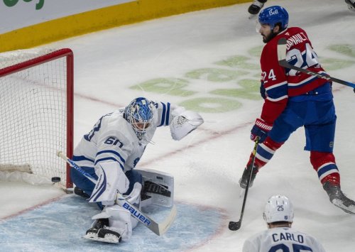 Montreal Canadiens' Phillip Danault (24) scores on Toronto Maple Leafs goaltender Joseph Woll (60) during first period NHL hockey action in Montreal on Tuesday, March 10, 2026. THE CANADIAN PRESS/Christinne Muschi