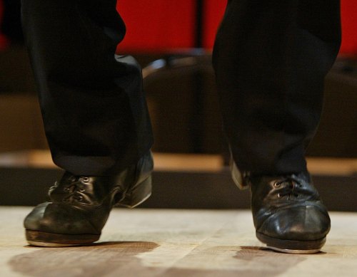 FILE - Tap sensation Savion Glover dances a number during a dress rehearsal for 