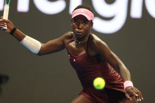 Canada's Victoria Mboko retruns to Czech Republic's Karolina Muchova during the Qatar Open tennis final in Doha, Qatar, on Saturday, Feb. 14, 2026. (AP Photo/Hussein Sayed)