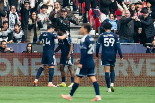 Vancouver Whitecaps' Brian White (24) celebrates his goal against Minnesota United with Emmanuel Sabbi (11) during the first half of an MLS Soccer match in Vancouver, on Sunday, March 15, 2026. THE CANADIAN PRESS/Ethan Cairns