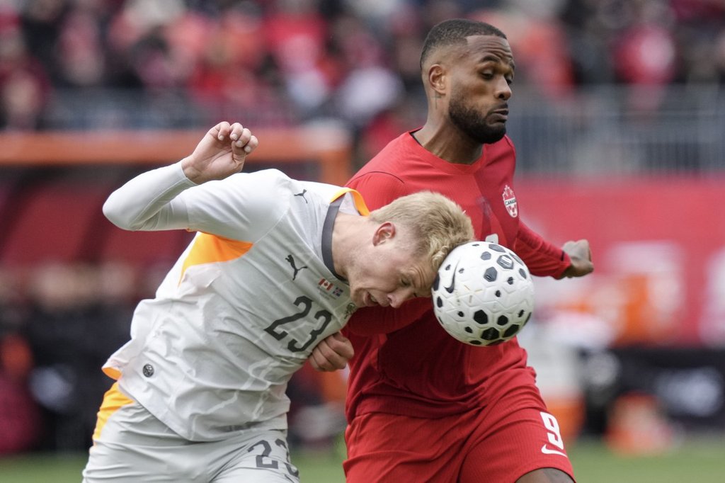 David scores twice from the penalty spot, Canada battles back to tie Iceland 2-2