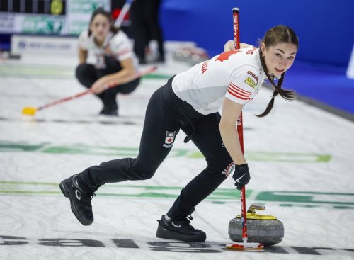 Team Canada lead Karlee Burgess sweeps against Norway at the World Women's Curling Championship in Calgary, Thursday, March 19, 2026. THE CANADIAN PRESS/Jeff McIntosh