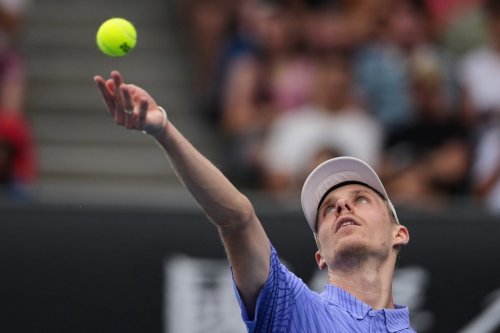 Denis Shapovalov of Canada serves to Bu Yunchaokete of China during their first-round match at the Australian Open tennis championship in Melbourne, Australia on Jan. 19, 2026. (AP Photo/Aaron Favila)