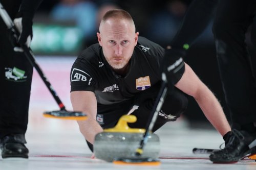 Team Jacobs skip Brad Jacobs delivers a stone during Canadian Olympic curling trials finals action against Team Dunstone in Halifax on Friday, November 28, 2025. THE CANADIAN PRESS/Darren Calabrese