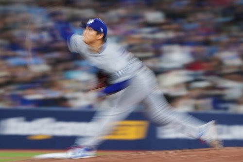 Los Angeles Dodgers pitcher Yoshinobu Yamamoto (18) works against the Blue Jays in a Major League Baseball game in Toronto on April 7, 2026. THE CANADIAN PRESS/Nathan Denette