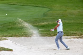 Canadian A.J. Ewart hits his ball out of a sand trap on the seventh. hole during the second round of the Texas Open golf tournament, Friday, April 3, 2026, in San Antonio. (Andrew J. Whitaker/The San Antonio Express-News via AP)