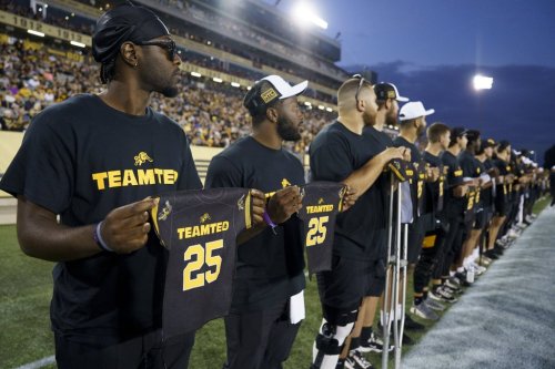 The Tiger-Cats honour late general manager Ted Goveia during a CFL game against the Winnipeg Blue Bombers in Hamilton, Ont., on Sept. 12, 2025. THE CANADIAN PRESS/Peter Power