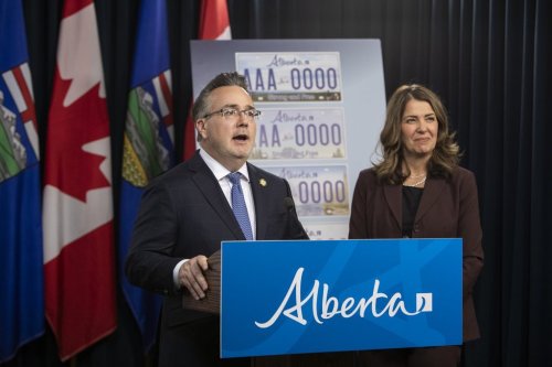 Minister of Service Alberta and Red Tape Reduction Dale Nally, left, with Alberta Premier Danielle Smith, announces a voting period for Alberta's new licence plates in Edmonton, on Wednesday, Oct. 15, 2025. THE CANADIAN PRESS/Amber Bracken