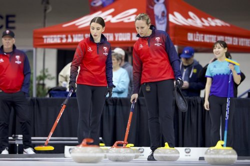 Maple United captain and women's skip Rachel Homan (right) discusses strategy with her third Xenia Schwaller (left) in a Tuesday, April 7, 2026 handout photo during a Rock League game against Typhoon at Toronto's Mattamy Athletic Centre. THE CANADIAN PRESS/Handout, The Curling Group, Anil Mungal (Mandatory Credit)