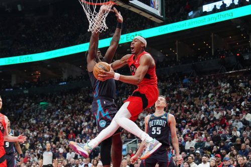 Toronto Raptors forward Scottie Barnes (4) is fouled by Detroit Pistons centre Jalen Duren (0) as Barnes jumps for the hoop during first half NBA basketball action in Toronto on Sunday, March 15, 2026. THE CANADIAN PRESS/Frank Gunn