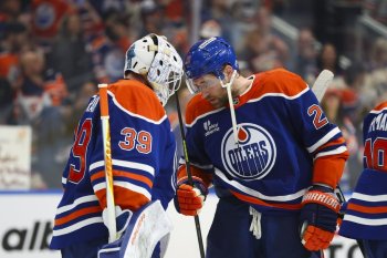 Edmonton Oilers goaltender Connor Ingram (39) and Leon Draisaitl (29) celebrate their victory against the Anaheim Ducks during third period first round Game 5 NHL playoff action in Edmonton on Tuesday, April 28, 2026. THE CANADIAN PRESS/Codie McLachlan