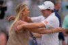 Matt Fitzpatrick, of England, right, hugs his wife Katherine Gaal after winning the RBC Heritage golf tournament Sunday, April 19, 2026, in Hilton Head, S.C. (AP Photo/Mike Stewart)