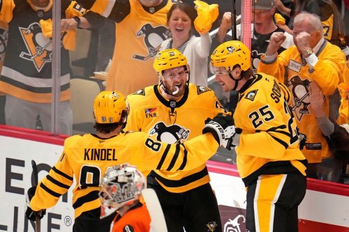 Pittsburgh Penguins' Elmer Soderblom (25) celebrates with Ben Kindel (81) and Anthony Mantha (39) after scoring against the Philadelphia Flyers during the first period of Game 5 in the first round of an NHL hockey Stanley Cup playoff series in Pittsburgh, Monday, April 27, 2026. (AP Photo/Gene J. Puskar)