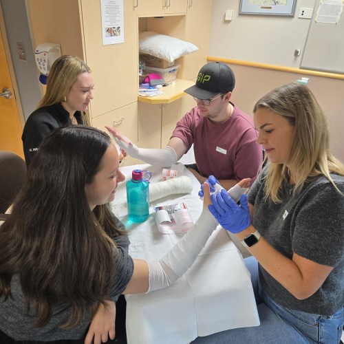 In this file photo, medical students from the University of Manitoba's Max Rady College of Medicine practise casting procedures at the Swan Valley Primary Care Centre as part of a program that gives students an opportunity to see what a rural physician practice could look like. (Prairie Mountain Health)