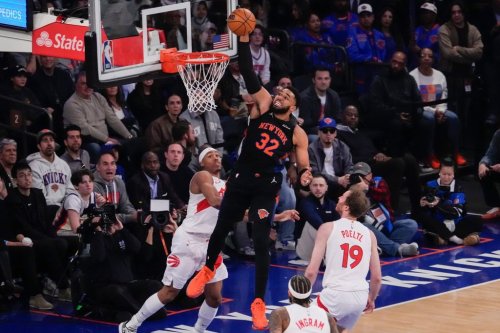 New York Knicks center Karl-Anthony Towns (32) dunks during the first half of an NBA basketball game against Toronto Raptors, Friday, April 10, 2026, in New York. (AP Photo/Yuki Iwamura)