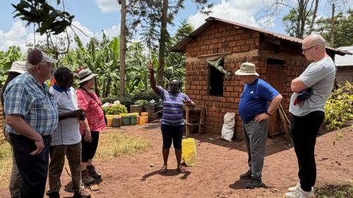 Foodgrains Bank Manitoba regional representative Dale Friesen (far right) visits Pauline (centre), a farmer and former project participant in Embu, Kenya, who has continued the work that she learned during a Foodgrains Bank-funded agriculture and livelihoods project implemented by ACC&S, local partner of Canadian Baptist Ministries. (Photo by Nicola Skinner)