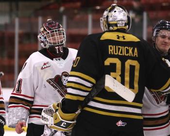 Calgary Hitmen goalie Eric Tu (31) prepares to embrace Brandon Wheat Kings netminder Filip Ruzicka (30) in the handshake line after Game 4 of their Western Hockey League quarterfinal series at Virden&rsquo;s Tundra Oil and Gas Place on Thursday. Calgary won 4-2 to sweep the series, with the two goalies both performing admirably. (Perry Bergson/The Brandon Sun) April 2, 2026
