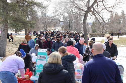 Parents and their children join the line to collect prizes after picking up eggs at Assiniboine College's North Hill campus during the annual Easter Eggstravaganza on Saturday afternoon. (Abiola Odutola/The Brandon Sun)