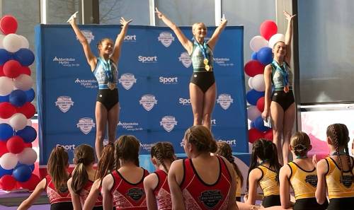 Brooklynn White, centre, celebrates her gold medal in gymnastics for Team West at the Manitoba Winter Games in Thompson on March 4. She is competing in Gymnastics Manitoba&rsquo;s provincial artistic championships on Sunday. (Submitted)
                                March 4, 2026