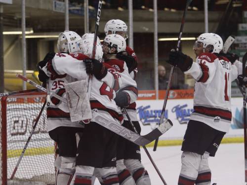 Members of the Virden Oil Capitals celebrate after defeating the Steinbach Pistons 4-3 in Game 6 of their best-of-seven semifinals matchup at Tundra Oil & Gas Place on Sunday night to clinch the series and punch a ticket into the Turnbull Cup final against the Niverville Nighthawks. (Massimo De Luca-Taronno/The Brandon Sun)