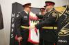New Manitoba First Nations Police Service Chief Jason Colon (left) is presented with the first of two star blankets during his swearing-in ceremony at the Waywayseecappo Convention Centre on Highway 10 on Tuesday morning. (Photos by Tim Smith/The Brandon Sun)