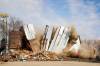 The grain elevator in Austin, built in 1951, comes crashing down on Wednesday during demolition by members of Pine Creek Hutterite Colony. (Photos by Tim Smith/The Brandon Sun)